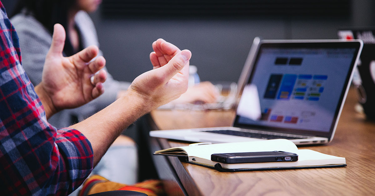 A person explaining a product strategy to the team in an office environment.